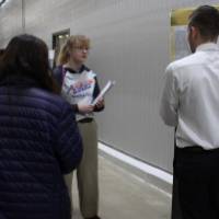 people looking at a senior project